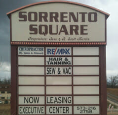 large, brick Sorrento Square sign made by mid state sign.